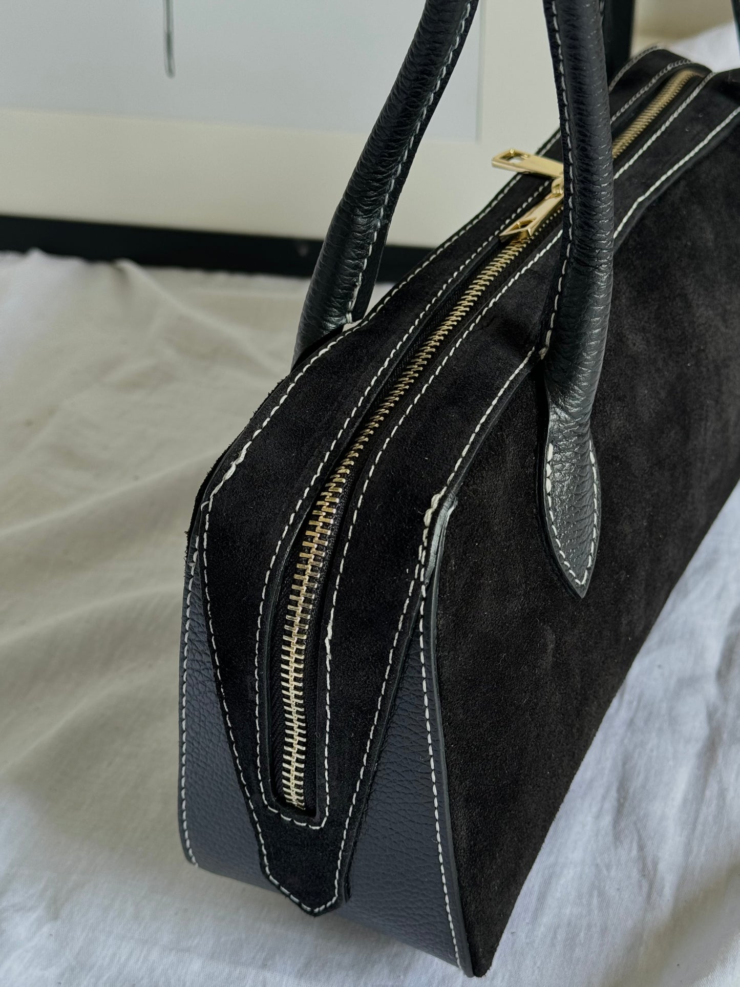 Italian baguette bag made of natural suede in a fashionable color