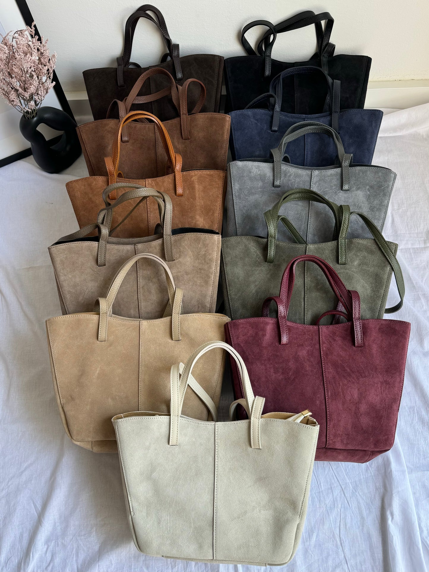 A shopper bag made of natural suede in a fashionable color, Italy